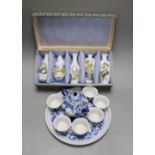 A Chinese blue and white miniature teapot, 6 matching cups and a tray and a box of five vases