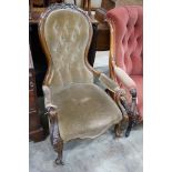 A Victorian carved walnut upholstered spoonback open armchair, width 66cm, depth 72cm, height 98cm