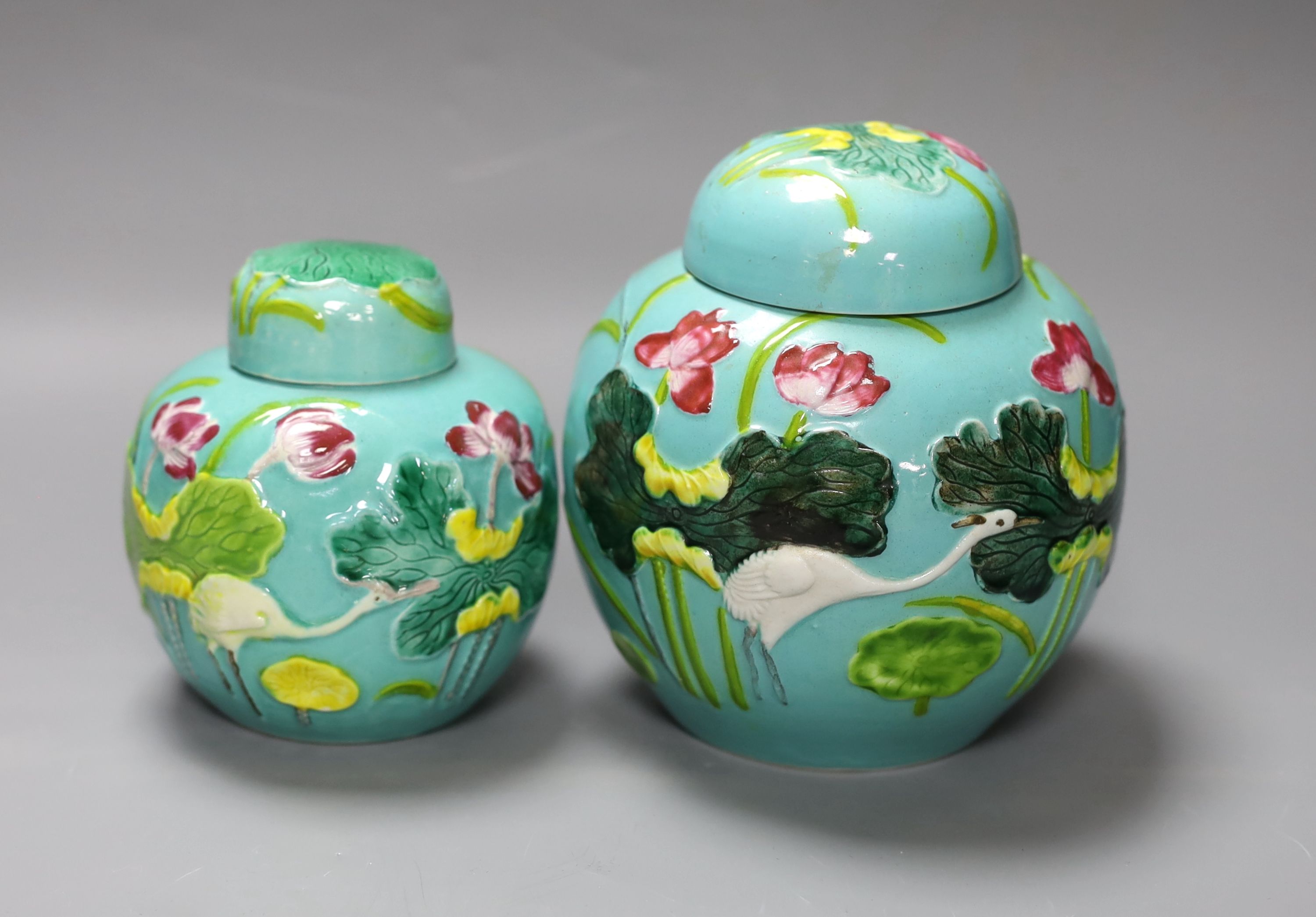 Two Chinese polychrome porcelain jars and covers, 20th century, tallest 15 cms high.