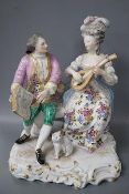 A 19th century Samson of Paris porcelain figure group of a lady playing a mandolin to her teacher