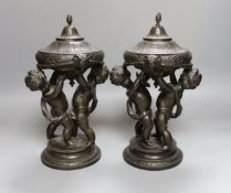A pair of late 19th century patinated spelter lidded cherubic jars 28cm