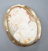 A yellow metal mounted oval cameo shell brooch, carved with the bust of a lady to sinister, 51mm,