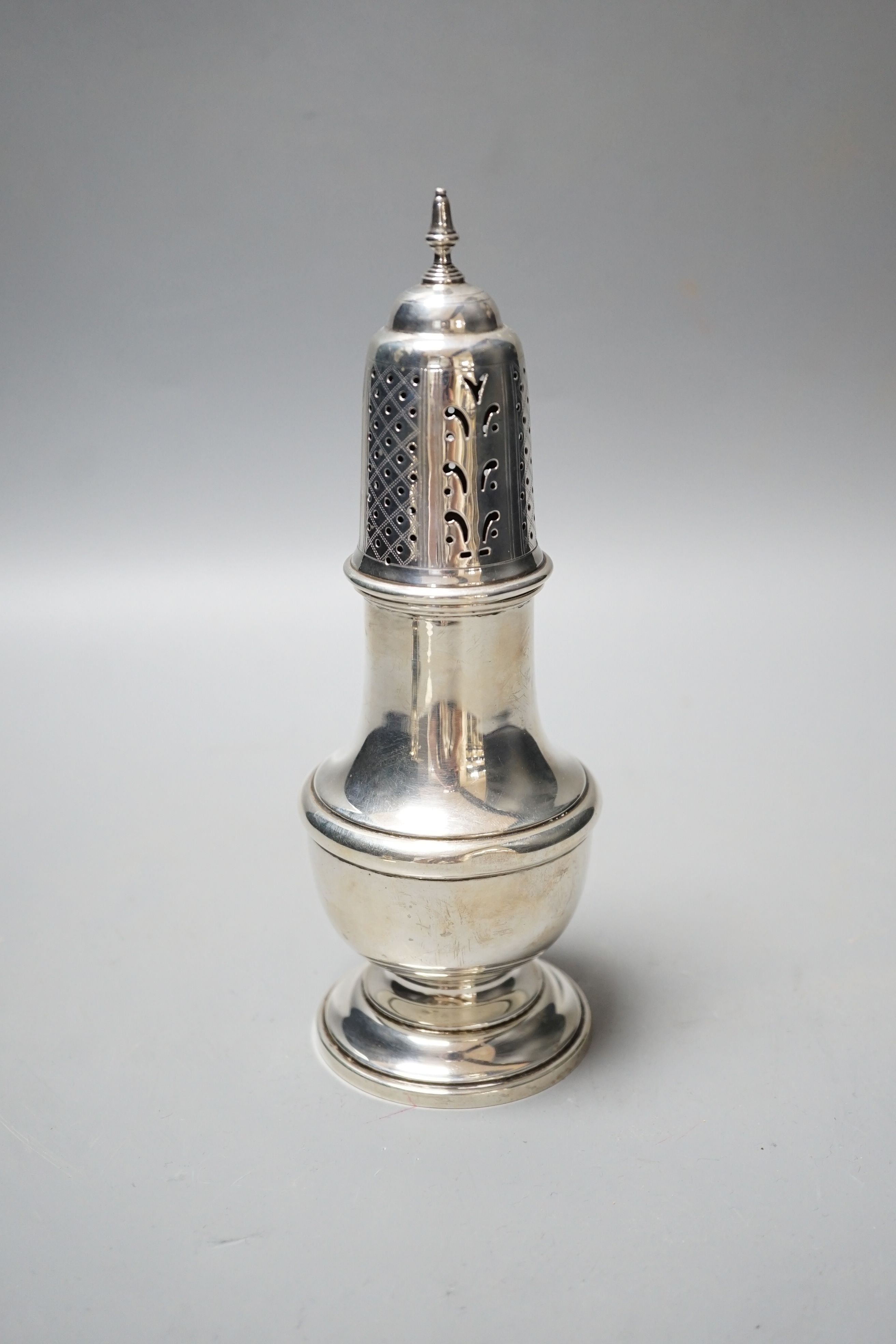 A George V silver baluster sugar caster, Birmingham, 1931, 19.8cm, 4.5oz.