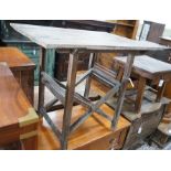 A provincial rectangular pine occasional table on folding stand, width 86cm, depth 63cm, height