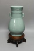 A Chinese celadon glazed arrow vase on a stand 35cm total height