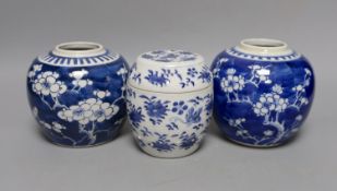 Two 19th century blue and white prunus jars and a barrel jar and cover. 12cm