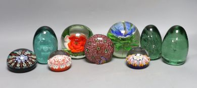A collection of nine glass paperweights including Victorian dumps and millefiori