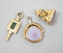A 19th century yellow metal overlaid and foil backed gem set fob seal, 25mm, a similar chalcedony