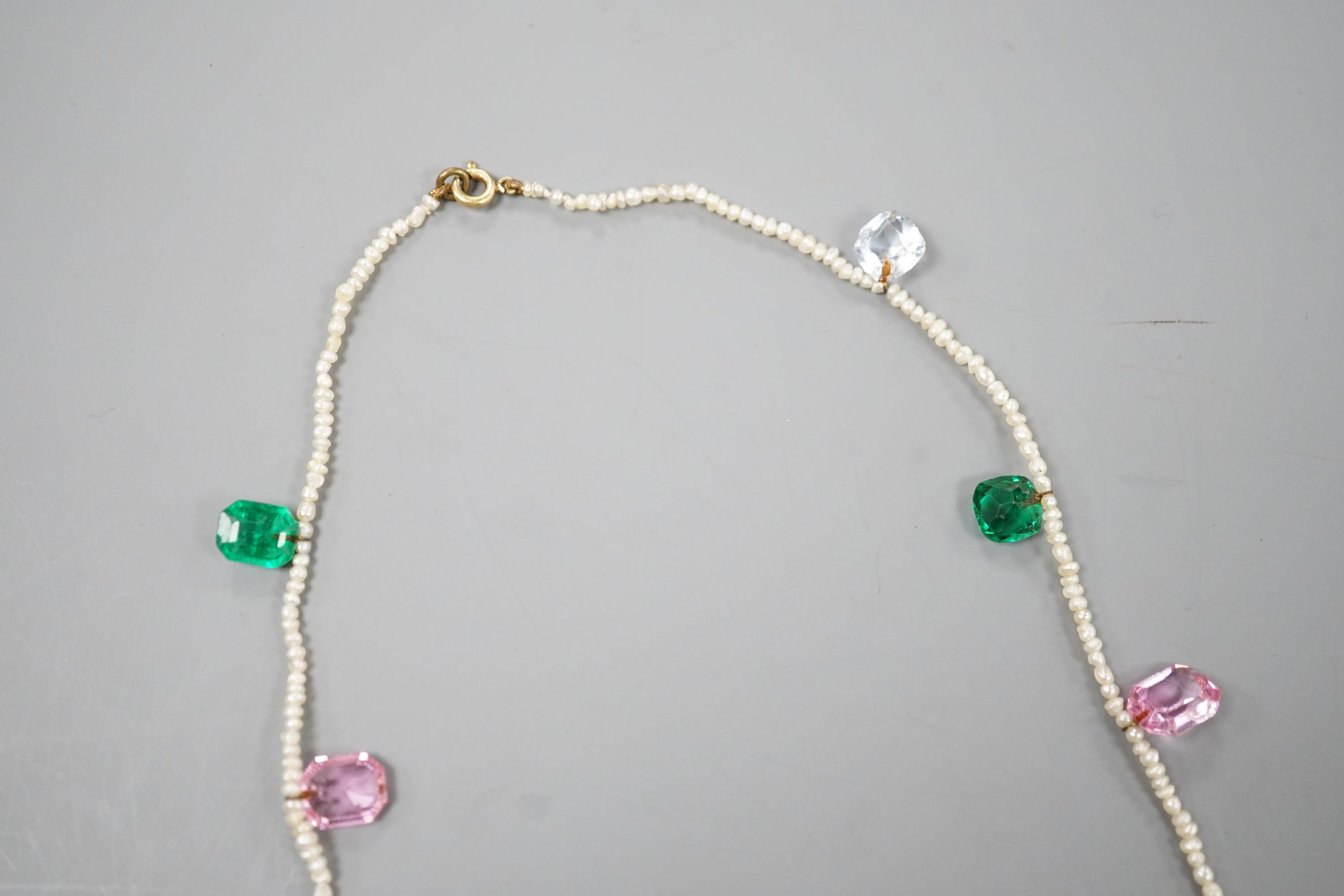A multi coloured paste and opal doublet set baroque seed pearl necklace, 42cm. - Image 9 of 10