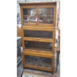 An early 20th century Globe Wernicke style oak four section glazed bookcase, width 87cm, depth 32cm,