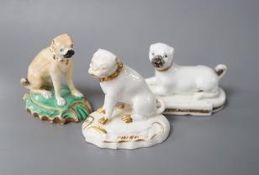 A Derby pug dog with white and gilt decoration, another pug dog perhaps Rockingham and an English