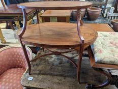 An Edwardian Sheraton revival oval inlaid satinwood two tier etagere, width 89cm, depth 55cm, height