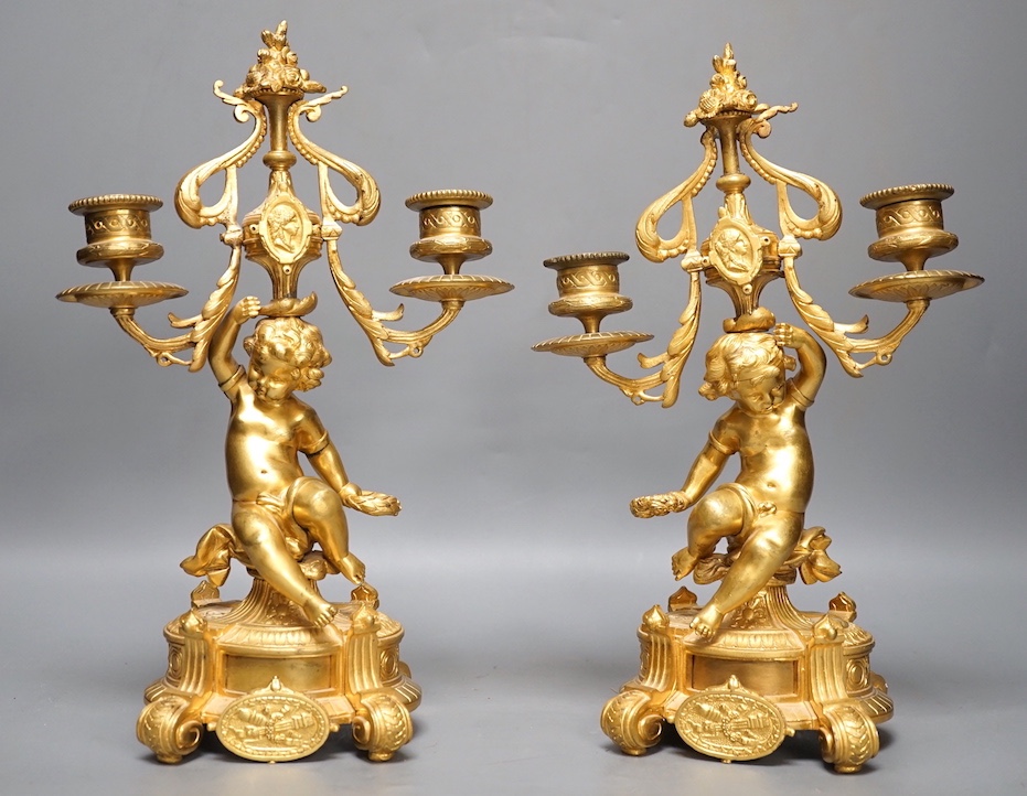 A pair of Louis XVI ormolu cherub candelabra 31cm