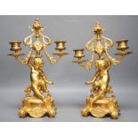 A pair of Louis XVI ormolu cherub candelabra 31cm