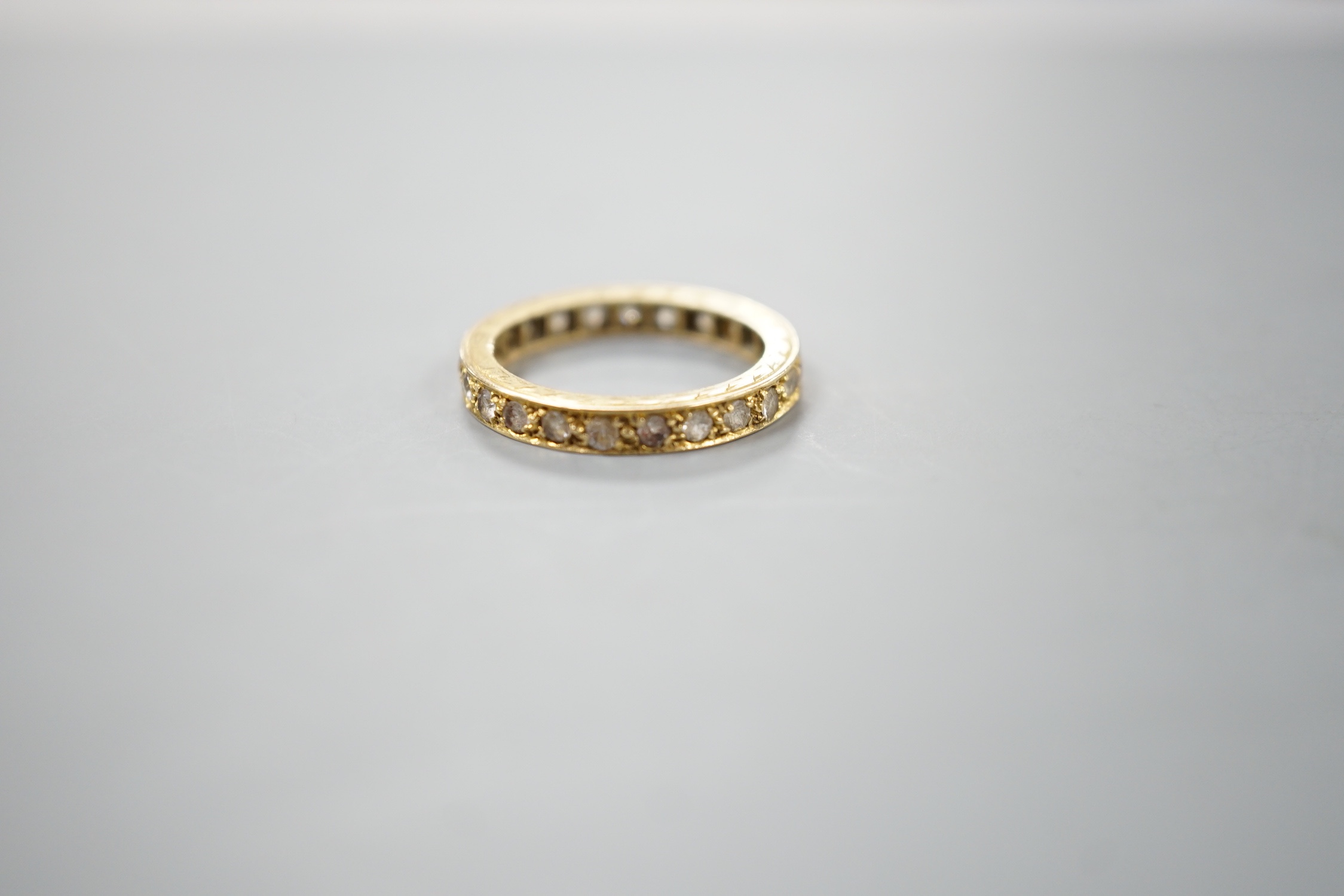 An 18ct and diamond chip set full eternity ring, size L, gross weight 3.4 grams. - Image 2 of 3