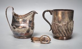 A George III silver cream jug, London, 1800, a later silver mug and a white metal and enamelled