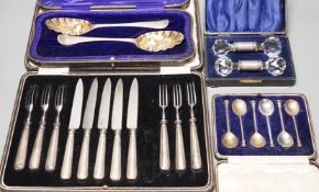 Two 18th century silver 'berry' spoons in associated case and three other cased sets including, pair