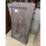 Three French wrought iron mounted slatted pine shutters each width 60 cms height 128 cms.