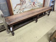 A late Victorian oak bench on six turned legs, length 200cm, depth 33cm, height 45cm