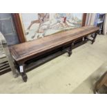 A late Victorian oak bench on six turned legs, length 200cm, depth 33cm, height 45cm