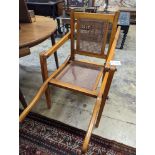 A late Victorian Leveson & Sons caned oak folding invalid's chair