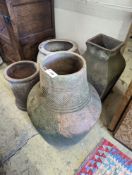 A large incised terracotta garden urn, height 72cm together with three other large earthenware