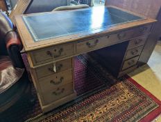 An Edwardian faded mahogany pedestal desk, stamped T. Willson, Great Queen Street, London, length