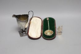 A George III silver helmet shaped cream jug, London, 1791, 13.2cm(a.f.), a silver menu holder and
