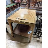 A mid century Danish teak two tier side table with tray top, width 71cm, depth 46cm, height 60cm