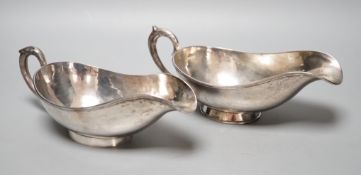 A pair of Chinese white metal sauce boats, by Yung Shun, 21.2cm, 11.5 grams.