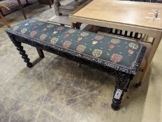 A Jacobean revival carved oak upholstered window seat, width 120cm, depth 29cm, height 40cm