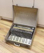 A cased Hohner accordion,Case 57cms wide.