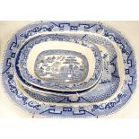 A 19th century blue and white meat platter and four similar dishes