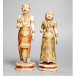 A pair of 18th century painted carved Indian ivory figures, male 7.6cm high female: 5.5cm high