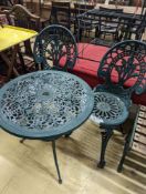 A circular painted aluminium garden table, diameter 60cm, height 62cm together with two chairs