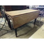 A Victorian pine drop flap kitchen table fitted drawer, width 122cm, length 117cm extended, height