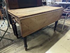 A Victorian pine drop flap kitchen table fitted drawer, width 122cm, length 117cm extended, height