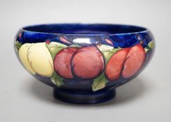 A Moorcroft Wisteria pattern bowl - 18cm wide