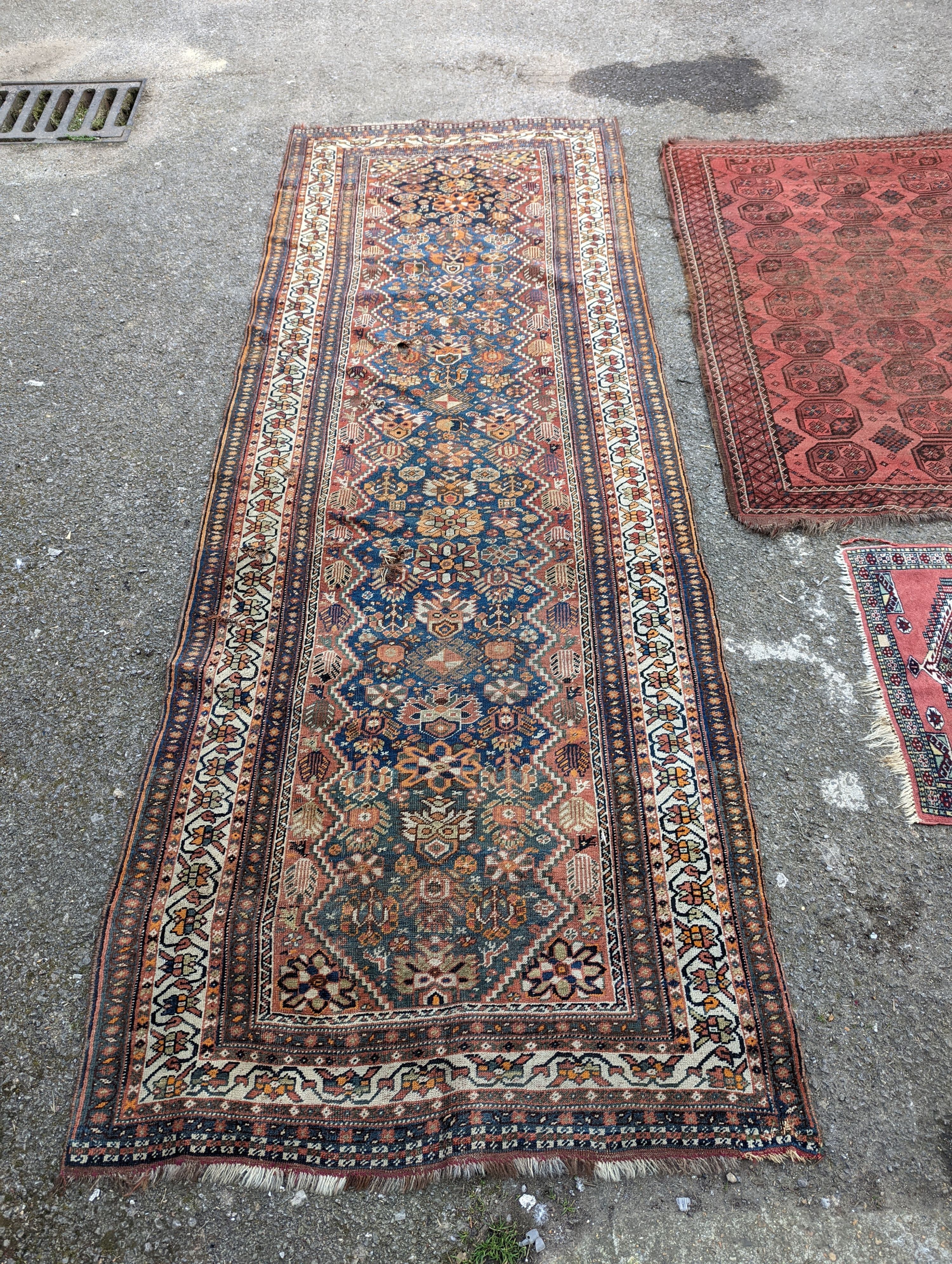 A North West Persian blue ground runner, 300 x 109 (worn and holed) a North West Persian rug, Bohara - Image 9 of 12