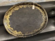 A Victorian oval gilt decorated black lacquered papier-mache tray, by Mechi, length 79cm, width