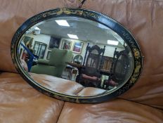 A 1920's oval chinoiserie lacquer wall mirror, width 67cm, height 46cm - To be sold on behalf of The