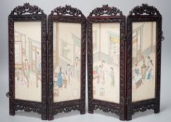 A Chinese hardwood framed painted silk four fold miniature screen, inset with painted silk panels,