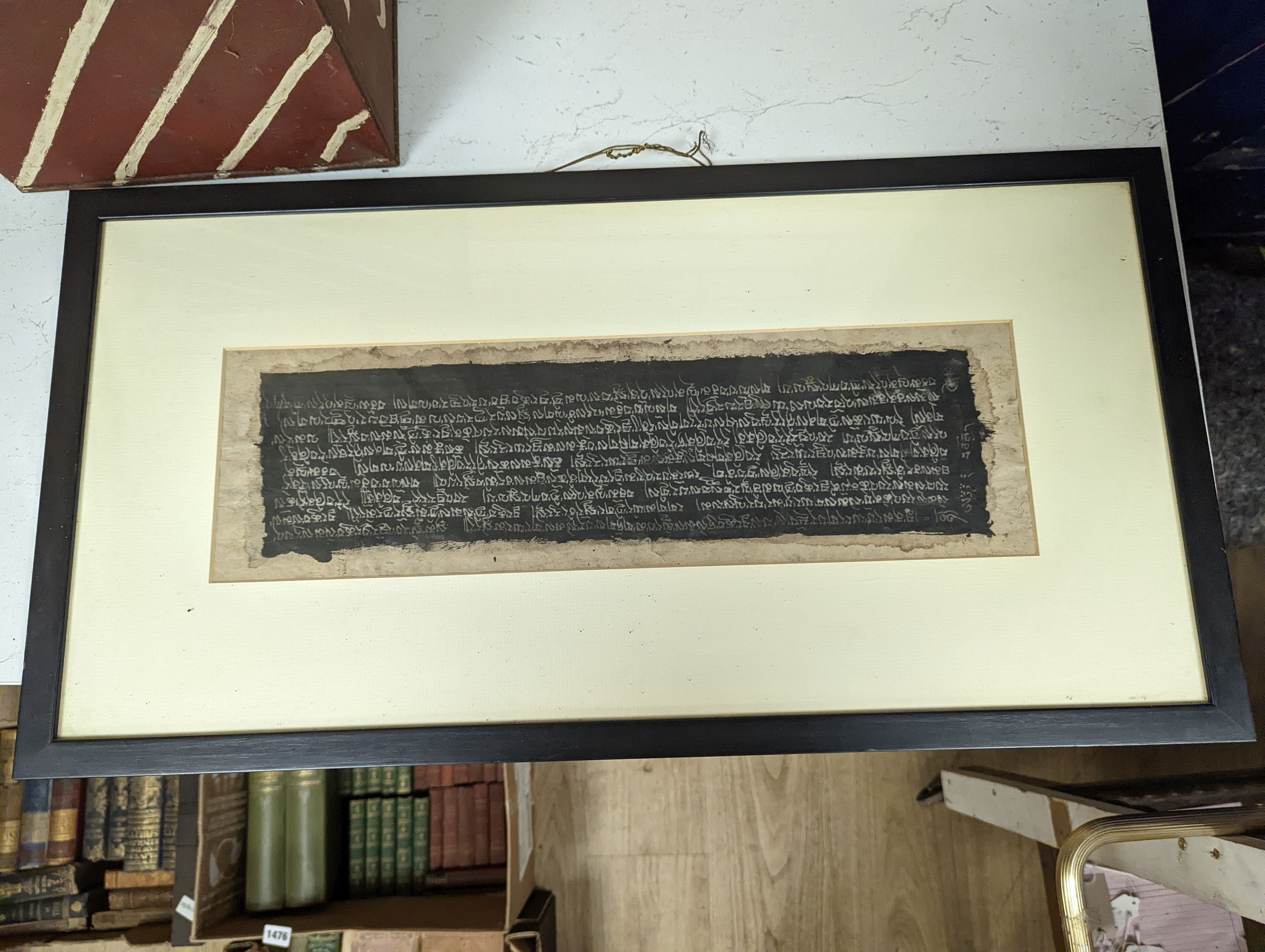 A framed Tibetan Sanskrit sutra panel,45cms x 13 cms. - Image 2 of 2