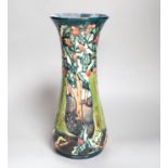 A Moorcroft vase with woodland scene - 30cm high