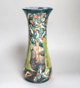 A Moorcroft vase with woodland scene - 30cm high