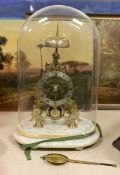 A brass skeleton clock under glass dome on marble base, single fusee,45 cms high.