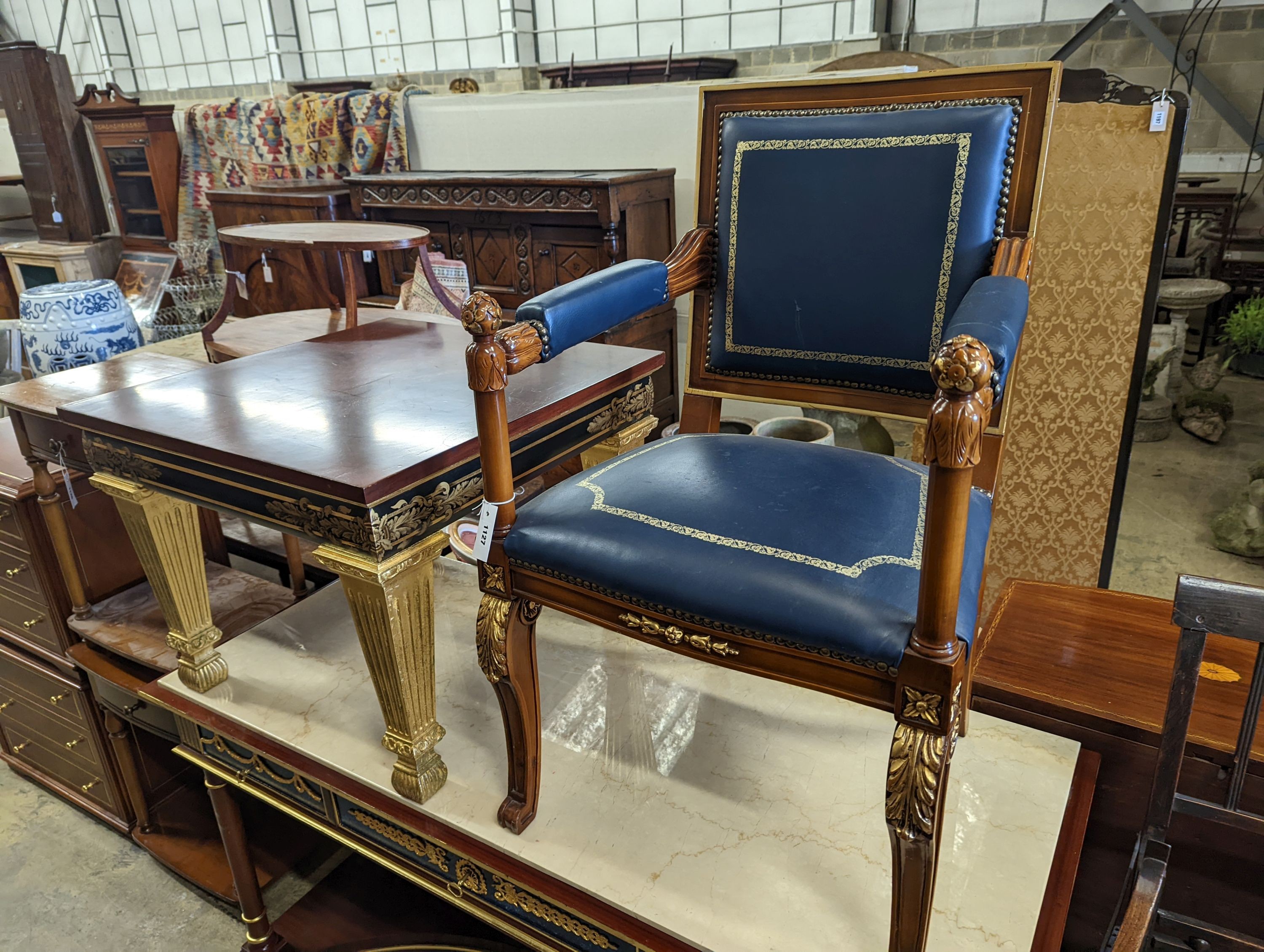 An Empire style parcel gilt mahogany elbow chair together with a similar square low occasional