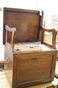 An early 19th century mahogany box commode with folding top and bone handled brass pump, width 57cm