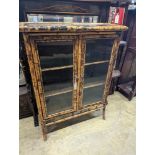 A late Victorian lacquer and bamboo glazed bookcase, length 77cm, depth 31cm, height 105cm