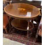 An Edwardian oval marquetry inlaid mahogany two tier occasional table, width 76cm, depth 54cm,